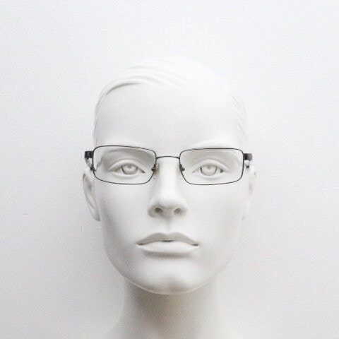 Calvin Klein collection rectangular eye glasses model 582 made in Japan. Gunmetal grey wire optical frames. Prescription eyeglasses. RX