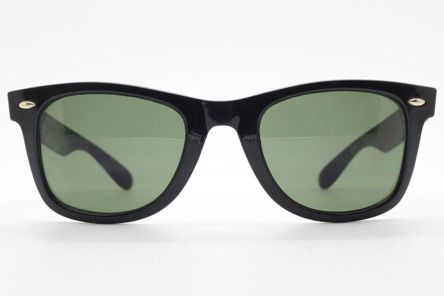 BCBG Max Azria vintage wayfarer design sunglasses. All time classic horn rim format in plain black gloss frame with green lenses.