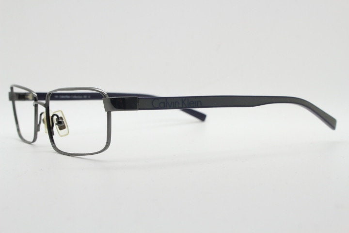 Calvin Klein collection rectangular eye glasses model 582 made in Japan. Gunmetal grey wire optical frames. Prescription eyeglasses. RX