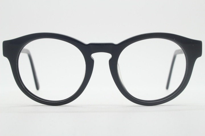 Will i Am round thick frame glasses model 30715554. Black gloss acetate optical frames with keyhole bridge. Prescription eyeglasses. RX