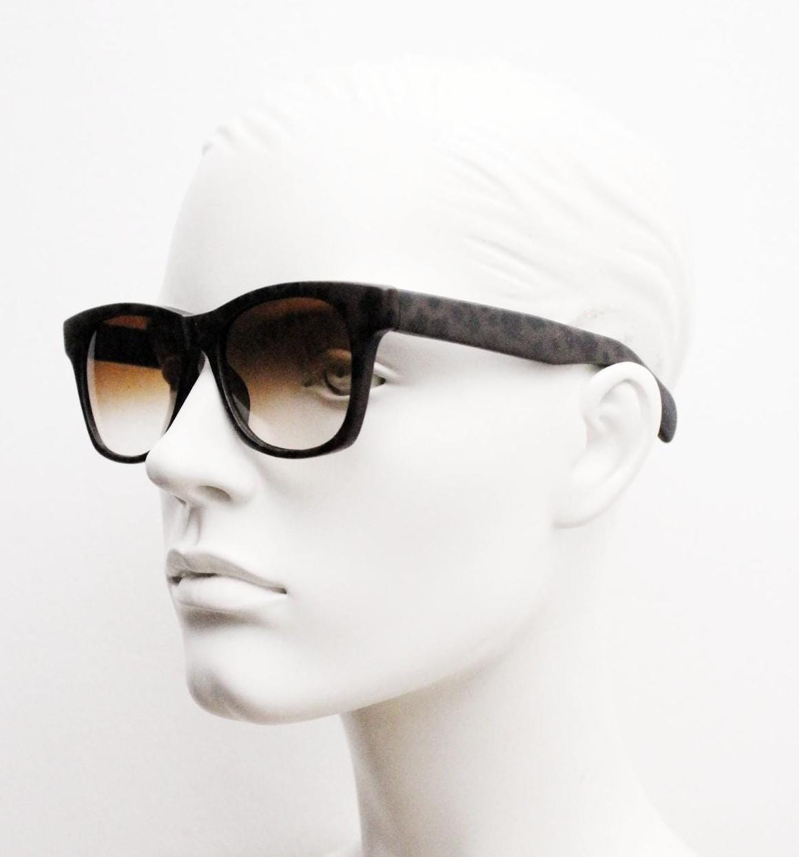Vintage 80s square horn rim sunglasses. All time classic design in chunky matt black and brown frame with superb graduating lenses. NOS