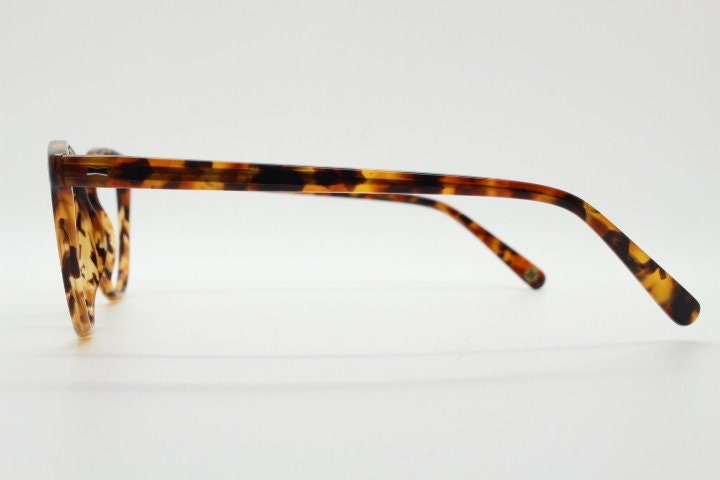 Cubitts vintage round 40s design hand made eye glasses. Honey tortoise acetate optical frame with keyhole bridge. Prescription RX