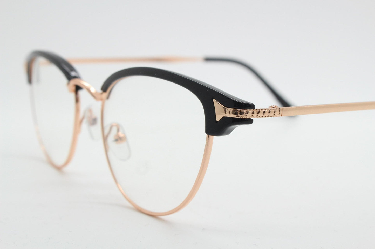 90s vintage browline cat eye glasses. Black gloss and gold half frame eyeglasses. 50s, 60s cateye design with clear lenses. NOS
