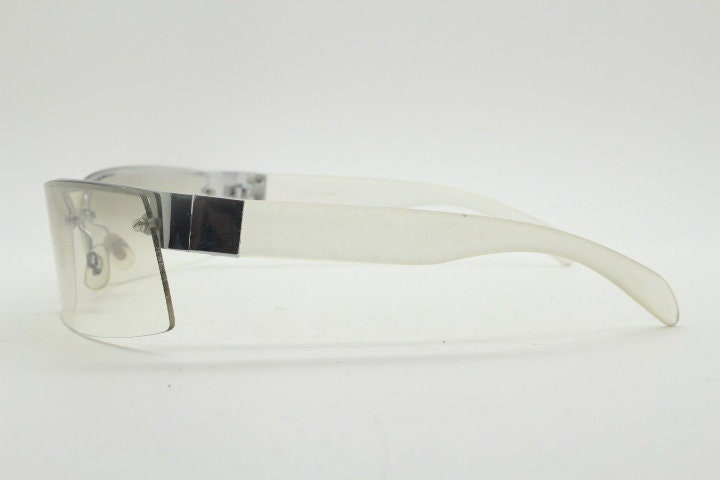 Y2K vintage wraparound sunglasses. Sick fashion grail half frame in silver chrome with extra light tone curving mirrored lenses. 2000's NOS