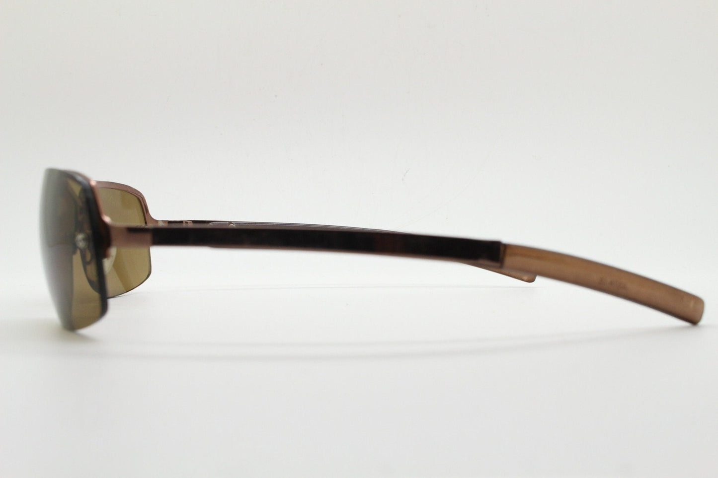 Y2K vintage modified small aviator sunglasses. Metallic brown chrome half frame with curved bug eye lenses and straight arms. 2000's. NOS