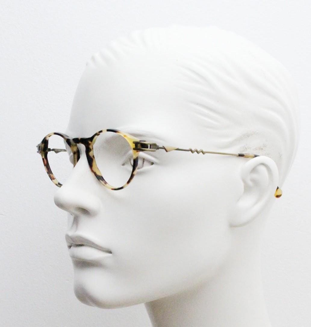 90s vintage oval eye glasses by No Limits. Honey tortoise optical frames with dynamic zig zag arms. Prescription RX spectacles. NOS