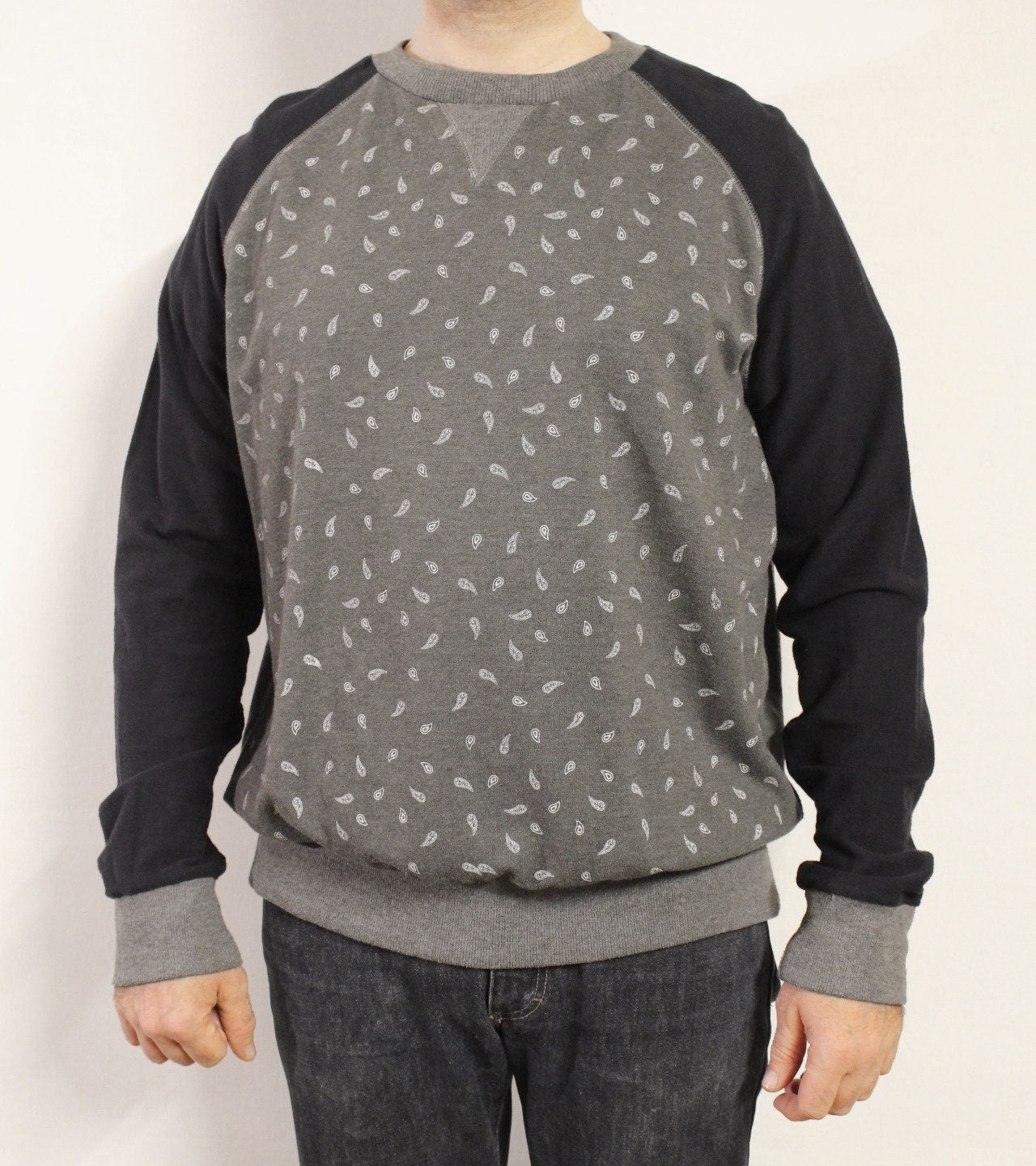 Grey paisley sweatshirt with navy blue sleeves. Mens crew neck pullover. Fitted round neck jumper size medium