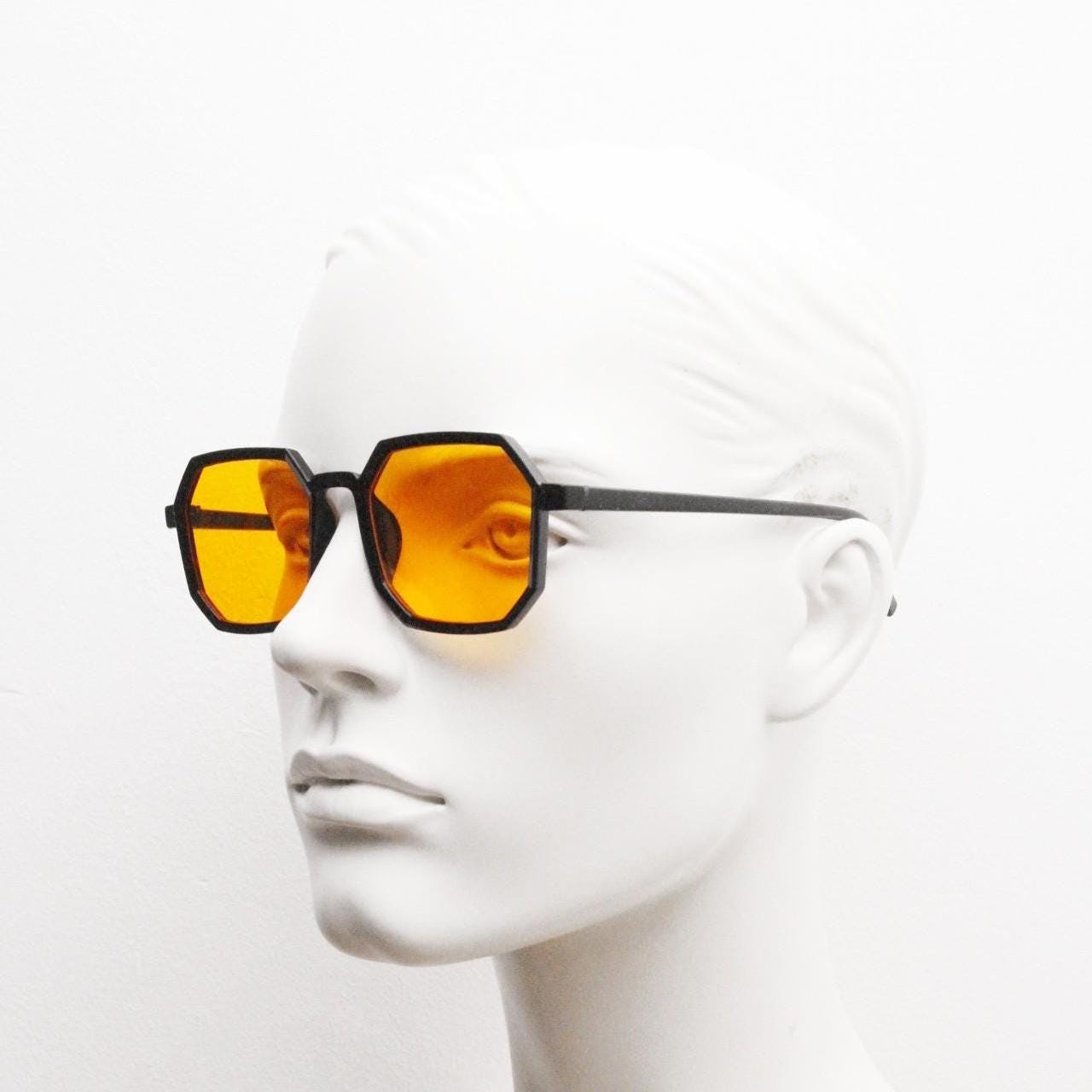 Vintage octagon sunglasses. Well proportioned subtle 8 sided black gloss frame with intense orange lenses. Rave. BNWT. NOS