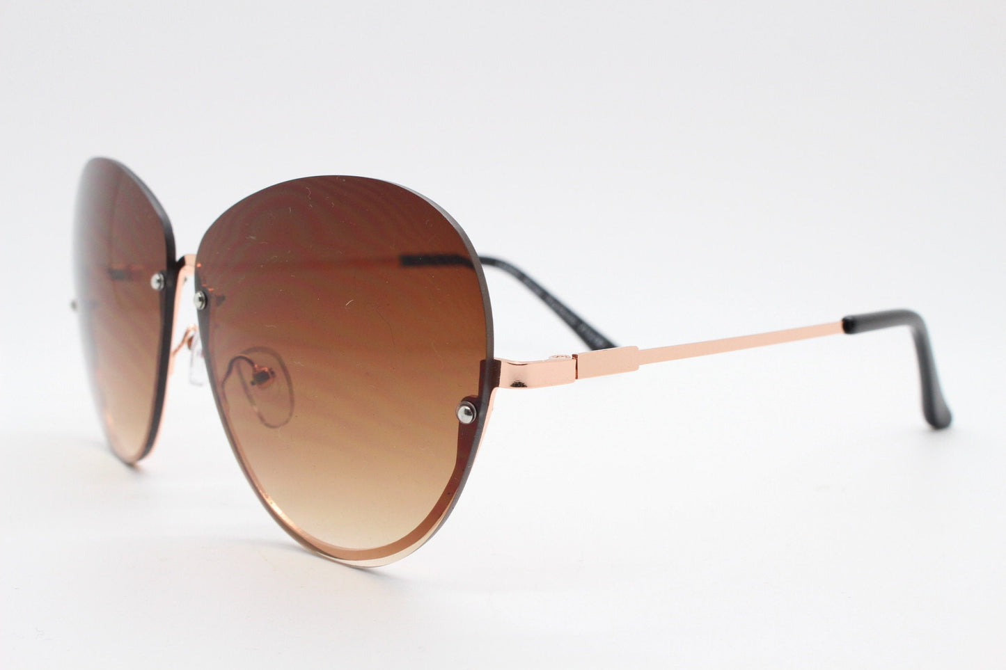 Y2K vintage large rimless sunglasses. Women's 70s style half frame design with graduating brown lenses and gold arms. 2000s BNWT