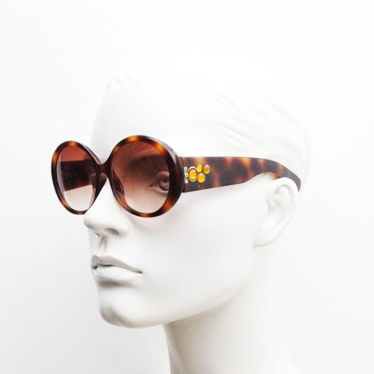 90s vintage round sunglasses. 60s style thick honey tortoise frame with graduating lenses and amber diamantes. Rhinestone. Unused NOS