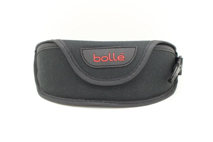 Bolle 90s vintage sports shield sunglasses. Aerodynamic clear lens wrap around half frame design in satin finish with tie string. Cycling