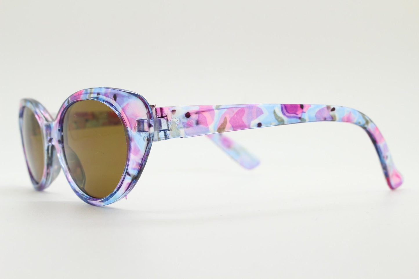 90s vintage oval cat eye sunglasses. Vibrant transparent multi coloured frame with mid tone brown lenses. 80s. NOS. BNWT
