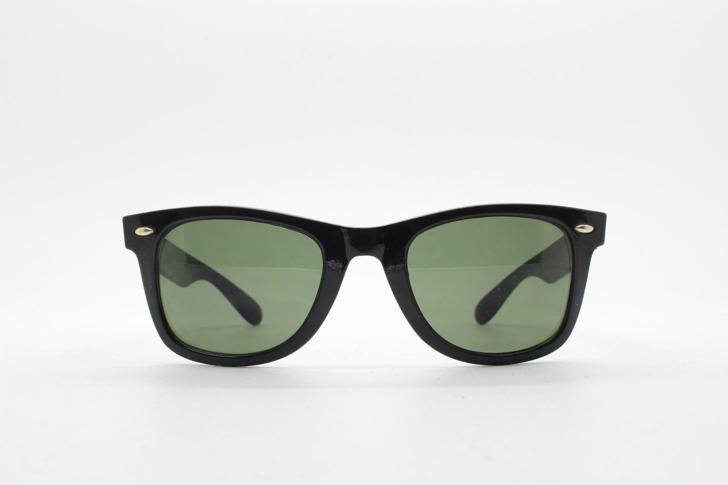 BCBG Max Azria vintage wayfarer design sunglasses. All time classic horn rim format in plain black gloss frame with green lenses.
