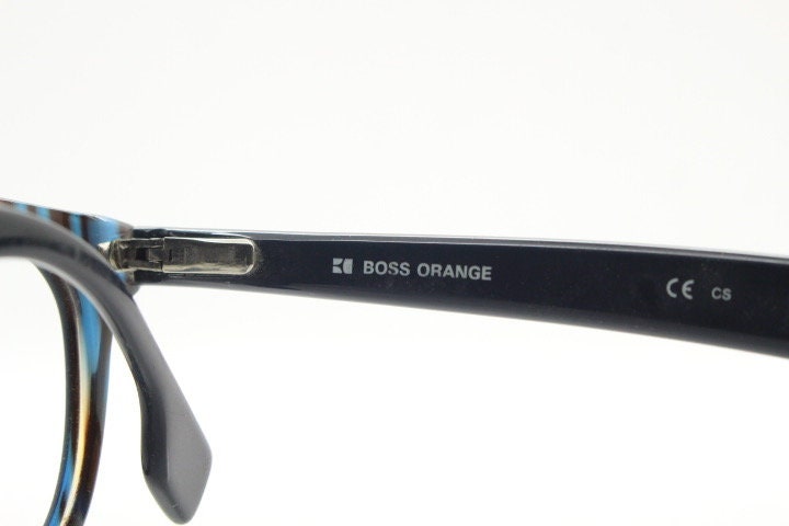 Boss Orange vintage wayfarer shape eye glasses. Black and navy striped optical frames with keyhole bridge. Prescription eyeglasses. RX Hugo