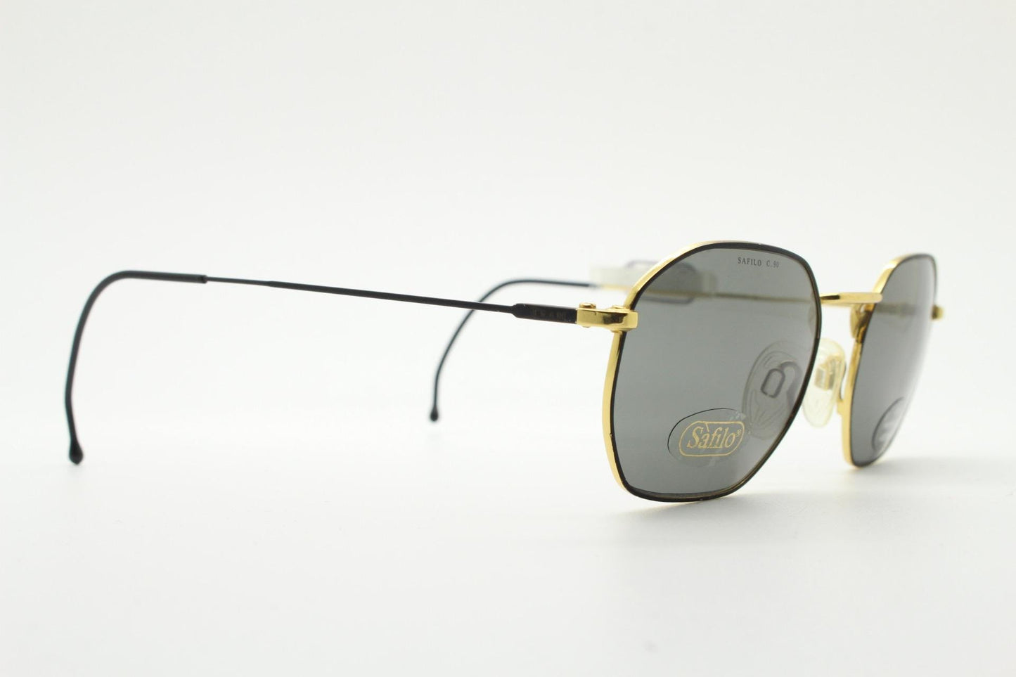 Safilo 90s vintage angled rectangular sunglasses made in Italy. Flexible black wire metal frame with gold trim and green lenses. BNWT NOS