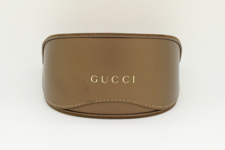 Gucci Y2K vintage oversized square sunglasses made in Italy. Transparent mottled brown frame with glitter sparkles and big stand out logo