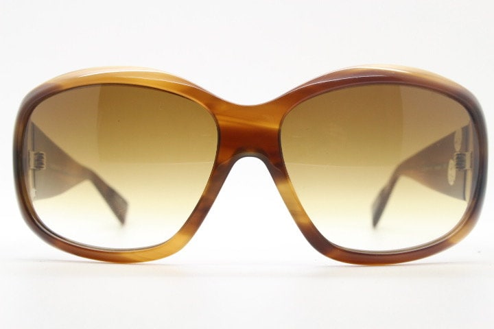 Oliver Peoples vintage Y2K wrap around sunglasses model Vanadis made in Japan. Big bug eye with tall arms in mottled brown acetate frame