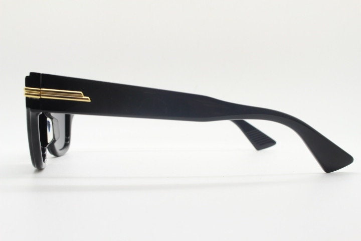 Bottega Veneta thick flat top cat eye sunglasses made in Japan. Black gloss acetate frame with sharp cropped sides. Womens cateye. BNWOT