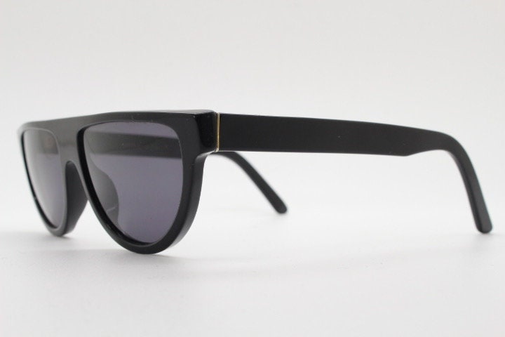 Retrosuperfuture thick flat top cat eye sunglasses hand made in Italy. All black gloss acetate frame. Vintage