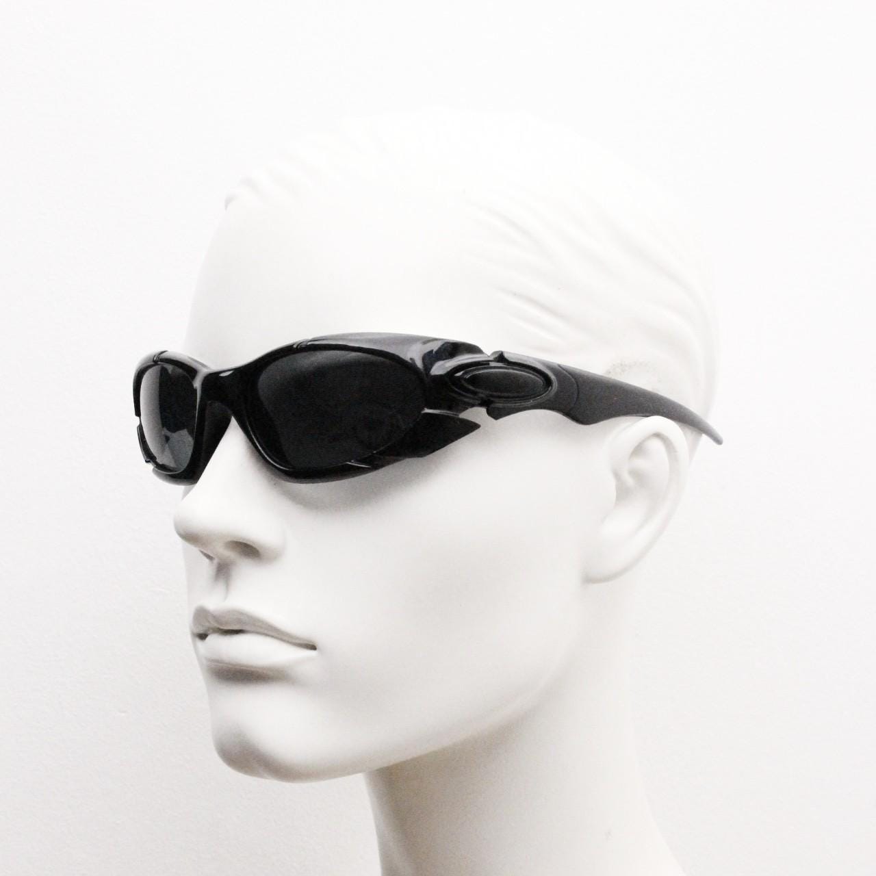90s vintage sports shield sunglasses. All black gloss aerodynamic wraparound with many stylised features. 2000's. Hells angel uber fashion