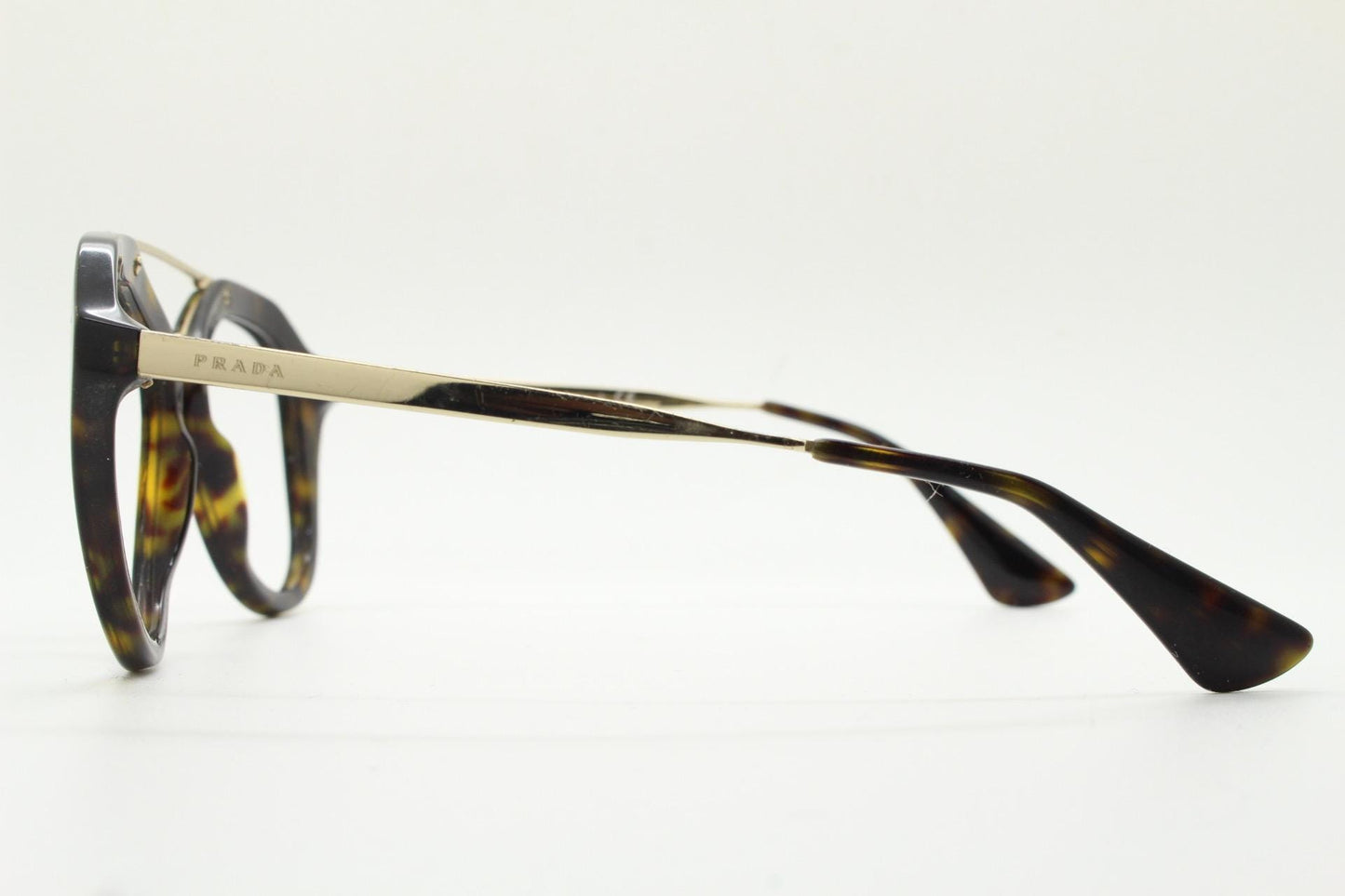 Prada angular eye glasses made in Italy. Thick tortoise acetate optical frames with prominent gold double bridge. Prescription. RX