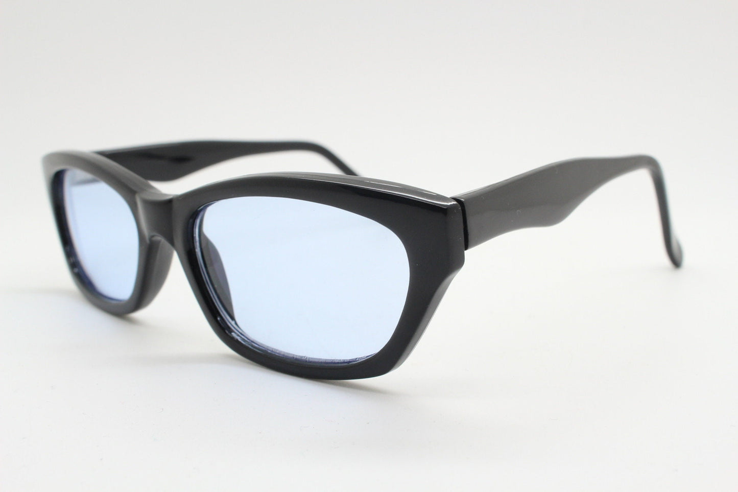 80s vintage rectangular sunglasses. Low profile 60s design black gloss frame with extra light tone sky blue lenses. BNWT Unused NOS