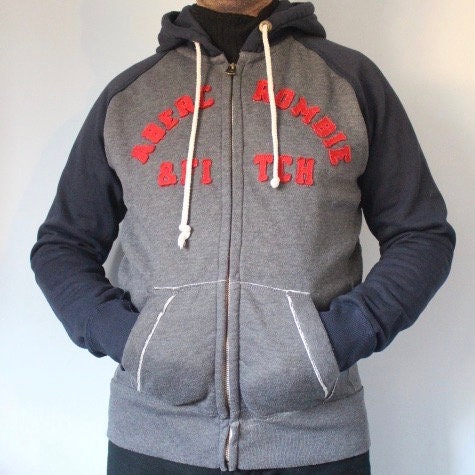 Abercrombie and Fitch grey and blue zipper sweat hoody with large red spell out patch letter chest logo. Mens all cotton medium size