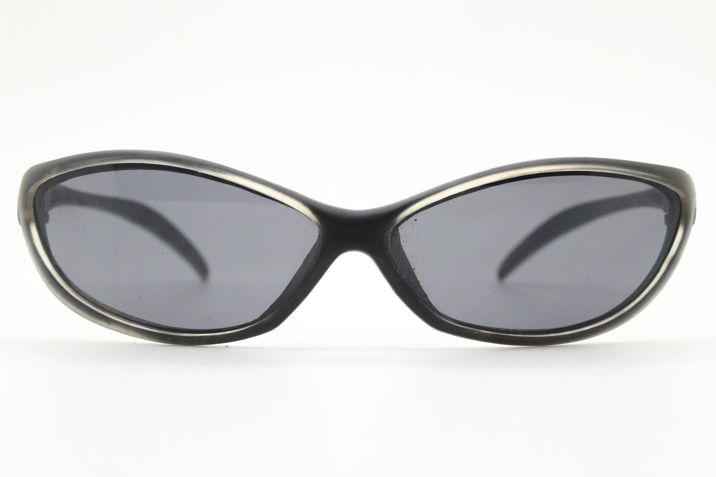 90s vintage curved wraparound sunglasses. Aerodynamic low profile transparent grey frosted frame. Minimal sporty shield design. NOS