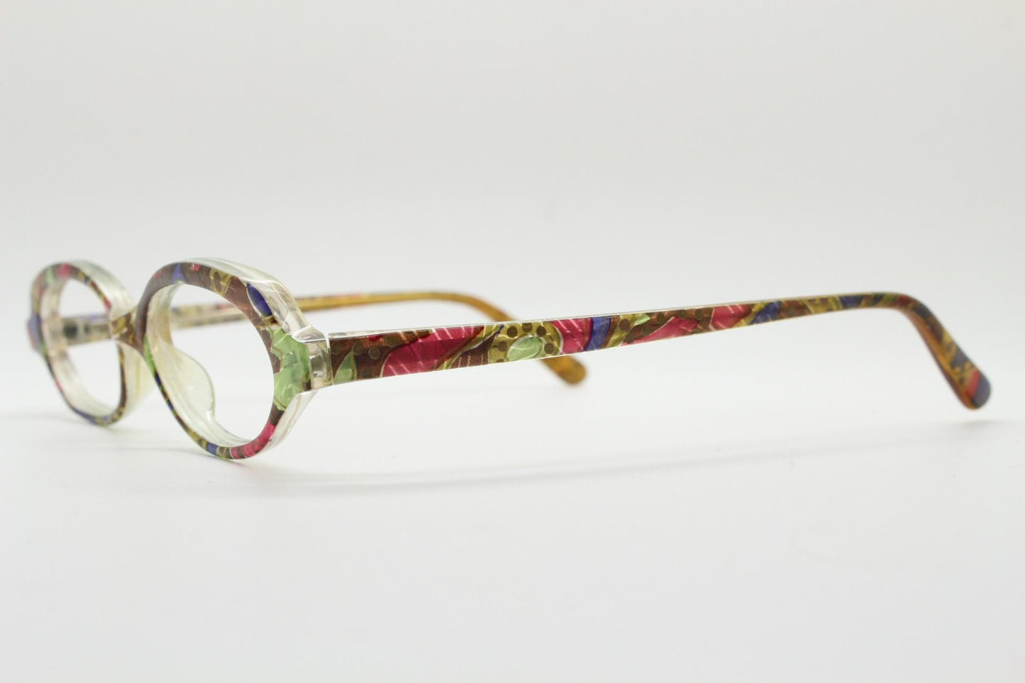 90s vintage small oval eye glasses. Low profile acetate optical frame with extraordinary abstract multi coloured pattern. Prescription RX