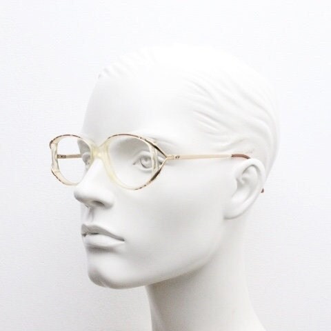 Valentino 90s vintage eye glasses made in Italy. Crystal and abstract pattern optical frames with golden forked arms. Prescription RX