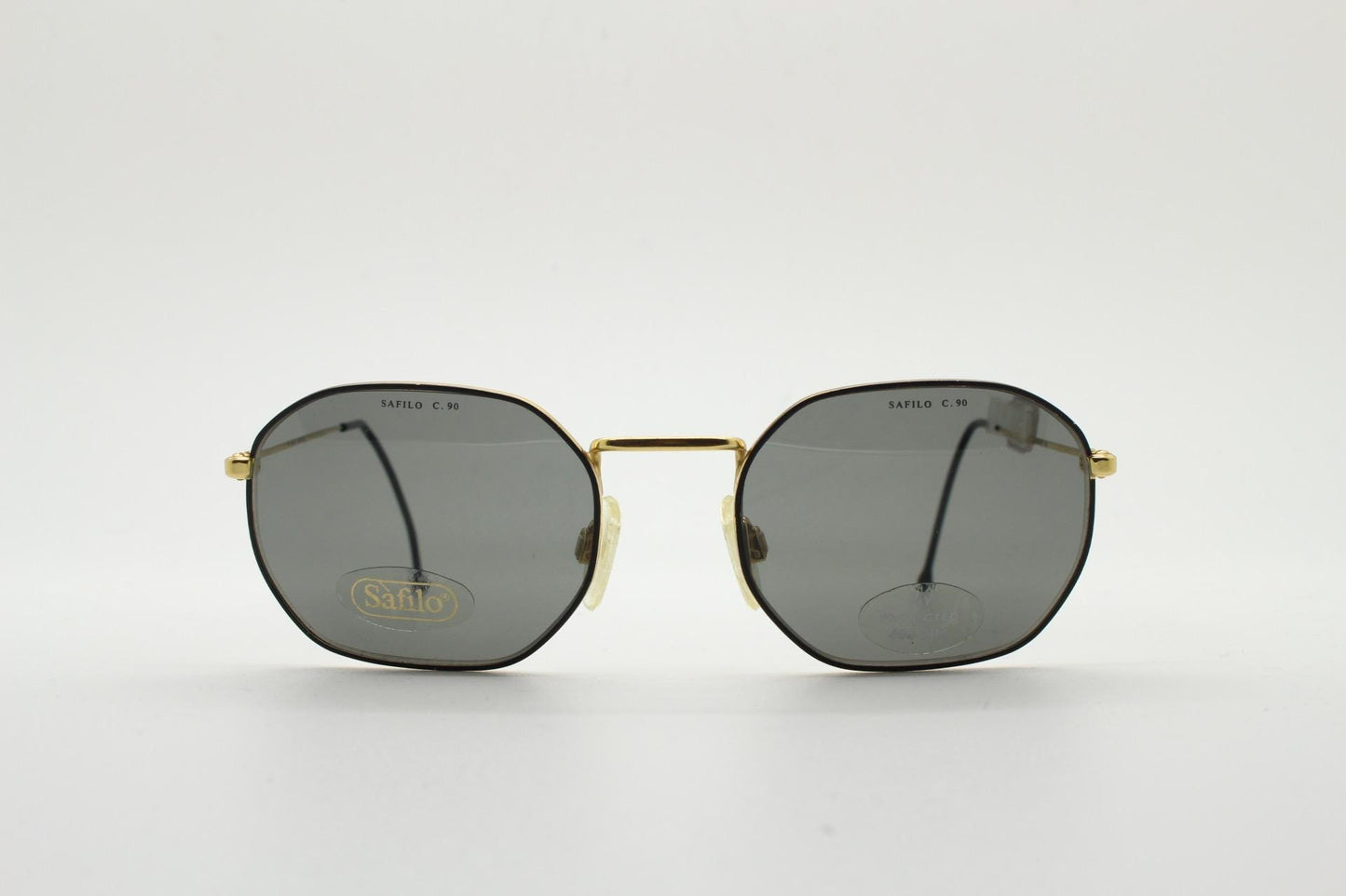 Safilo 90s vintage angled rectangular sunglasses made in Italy. Flexible black wire metal frame with gold trim and green lenses. BNWT NOS