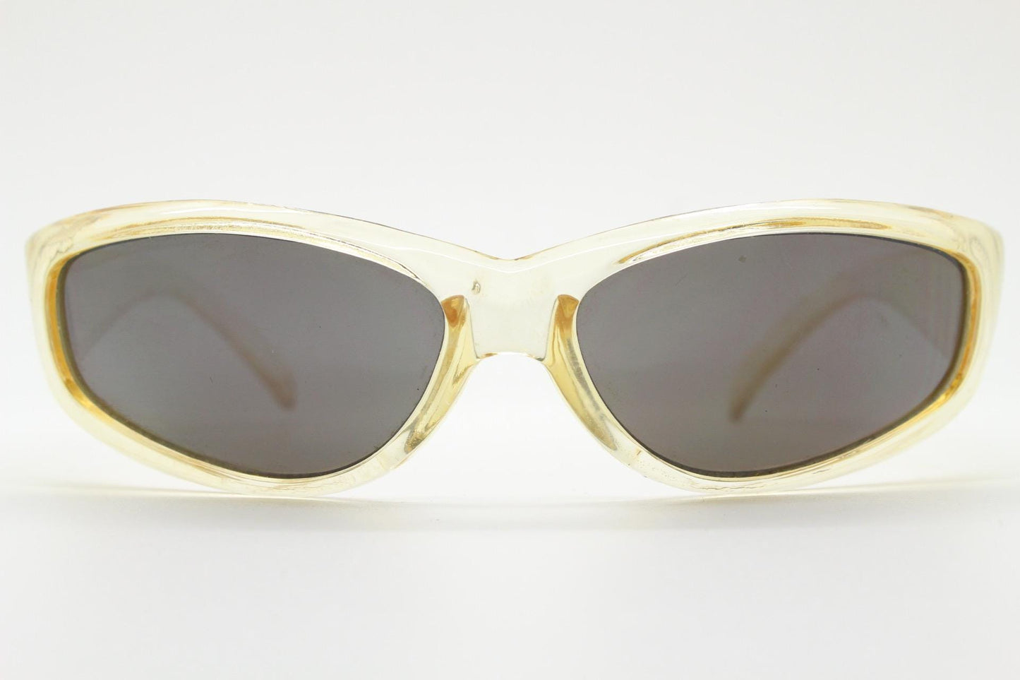 90s vintage sports shield sunglasses. Transparent yellow aerodynamic curved wraparound frame with contrasting black lenses. 2000's rave