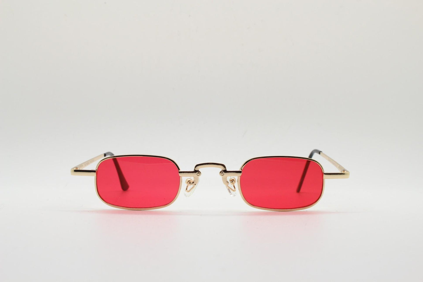 90s vintage small rectangular sunglasses. Imposing minimal gold metal victorian style frame with deep red lenses. Unused BNWT