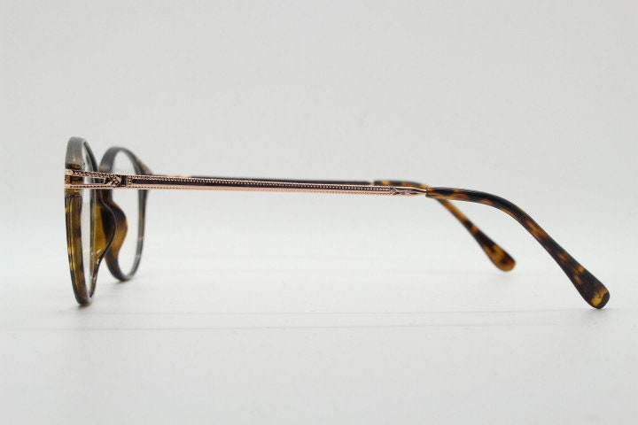 90s vintage round glasses with tortoise front and gold embossed arms. 40s, 50s style prescription optical frames. Clear lens eyeglasses. RX