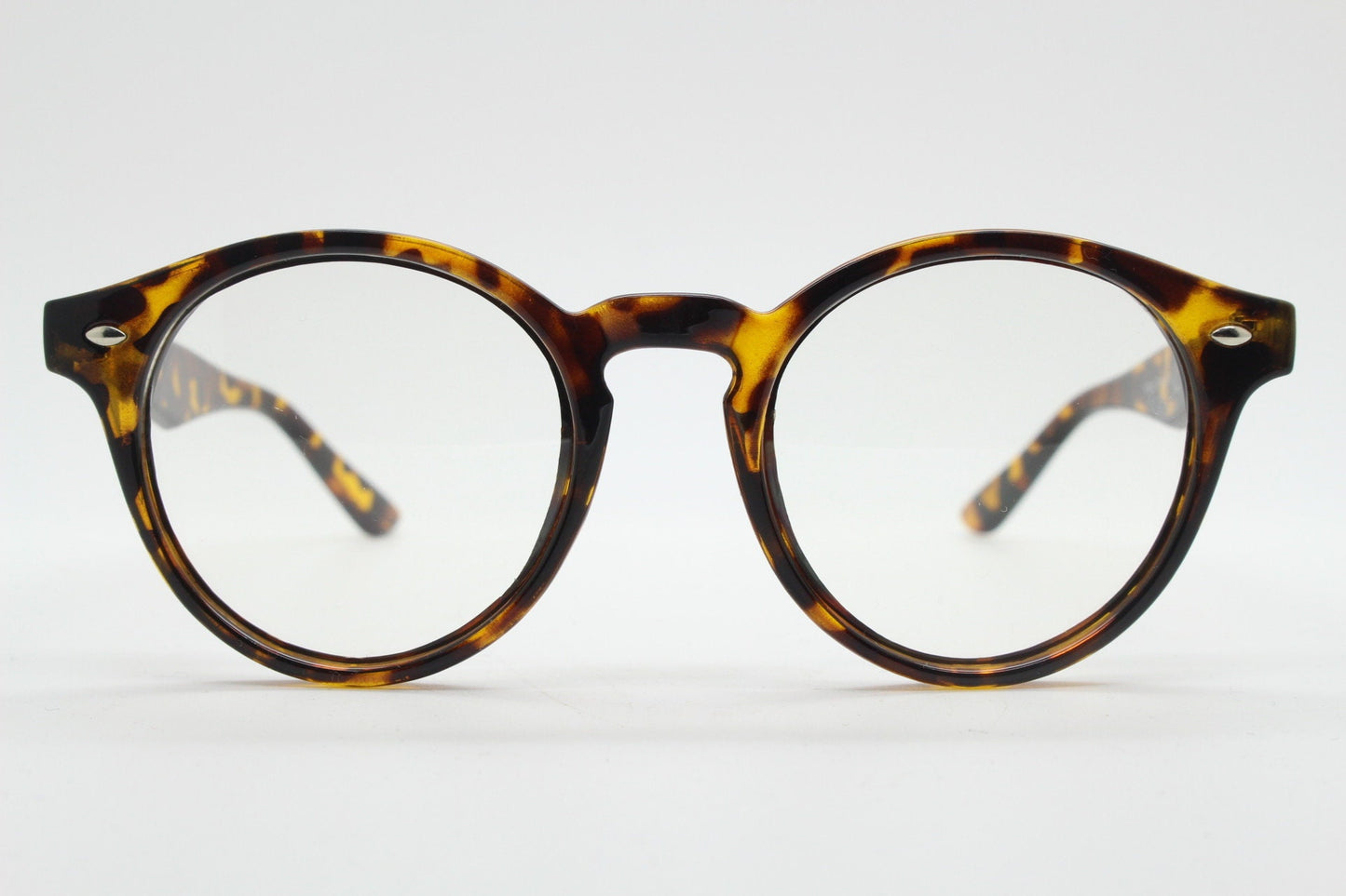 90s vintage round eye glasses. Tortoise gloss 40s design optical frame with keyhole bridge and clear lenses. Prescription RX Spectacles