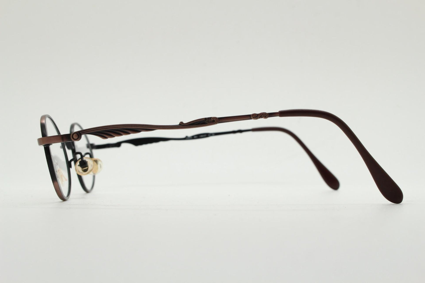 Paris Ma 90s vintage small oval eye glasses. Brushed bronze optical frames with scrolled arm details. Prescription. Steampunk spectacles NOS