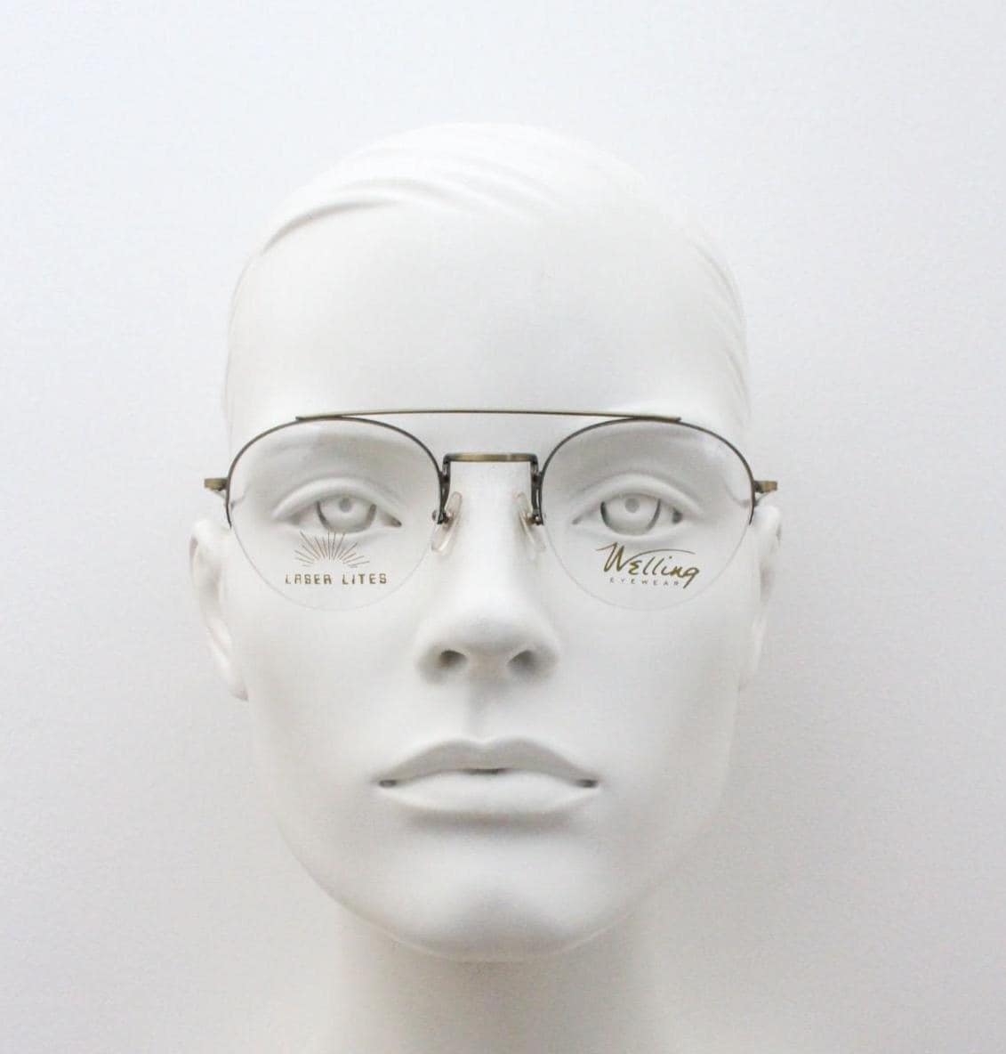 90s vintage round eye glasses made in Japan by Welling. Brushed bronze finish optical half frame. Prescription RX spectacles. NOS