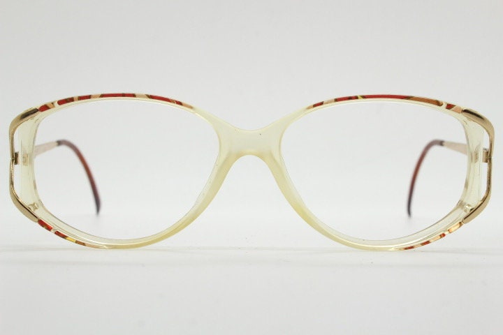 Valentino 90s vintage eye glasses made in Italy. Crystal and abstract pattern optical frames with golden forked arms. Prescription RX