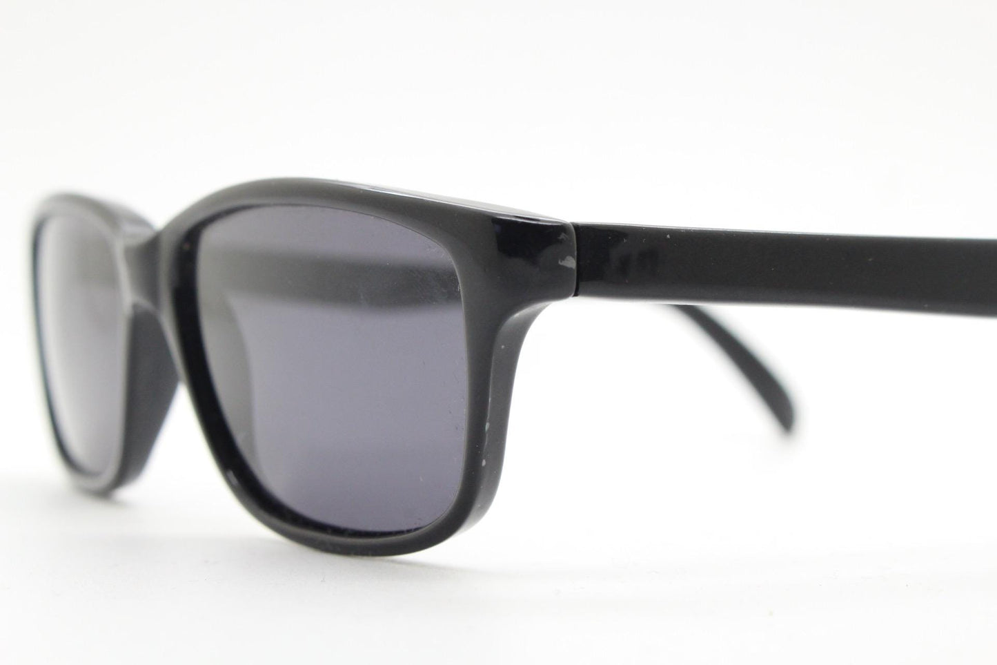 Vintage 90s slim rectangular modified wayfarer design sunglasses made in Italy. All black gloss low profile acetate frame. Unused NOS