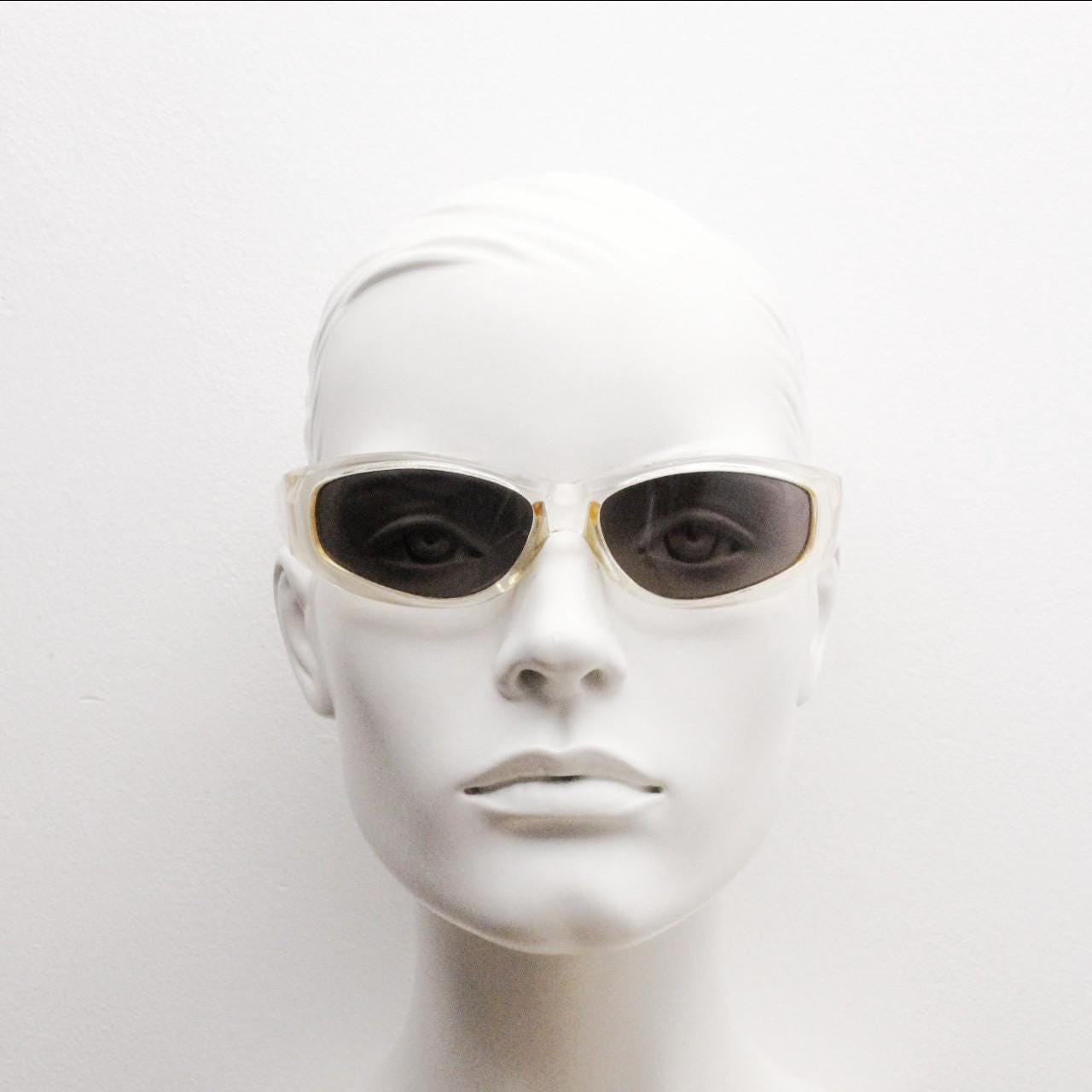90s vintage sports shield sunglasses. Transparent yellow aerodynamic curved wraparound frame with contrasting black lenses. 2000's rave