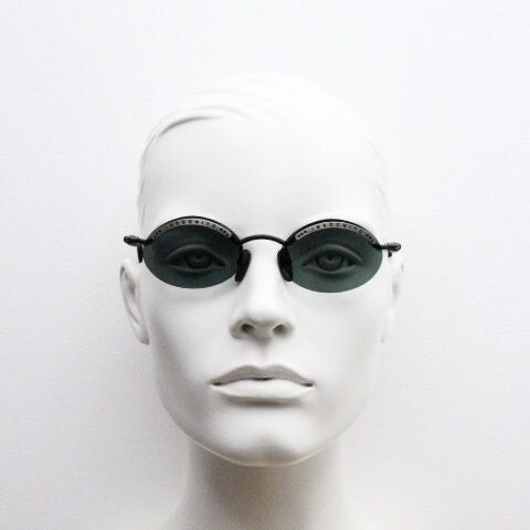 Inkognito 90s vintage small oval sunglasses. Matt finish half frame with spell out logo brow and polarising lenses. NOS