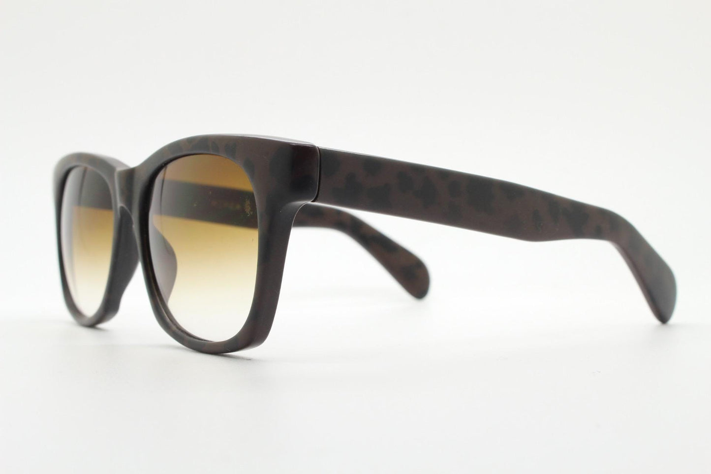 Vintage 80s square horn rim sunglasses. All time classic design in chunky matt black and brown frame with superb graduating lenses. NOS