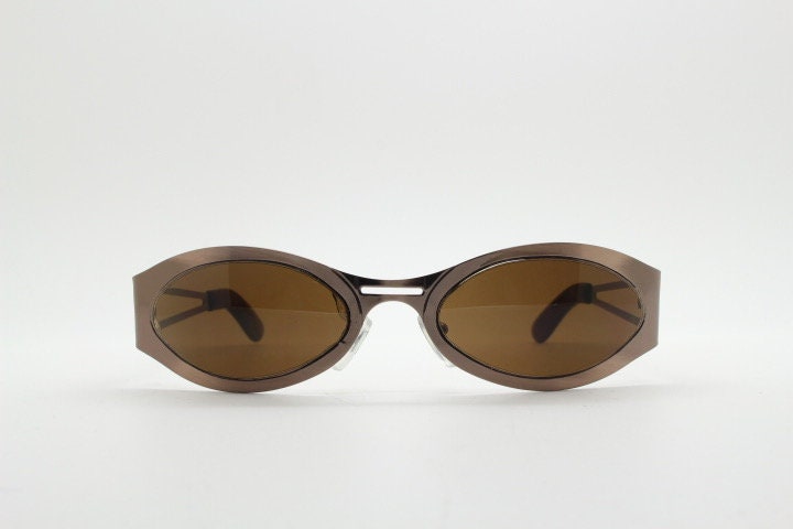 2000s vintage wraparound angular sunglasses. Brown chrome flat curved metal frame with cut out arms. 90s. Y2K unused NOS