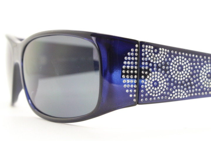 Assoluto 90s vintage wrap around rhinestone shield sunglasses made in Italy. Deep blue acetate frame with dazzling diamante circles. NOS