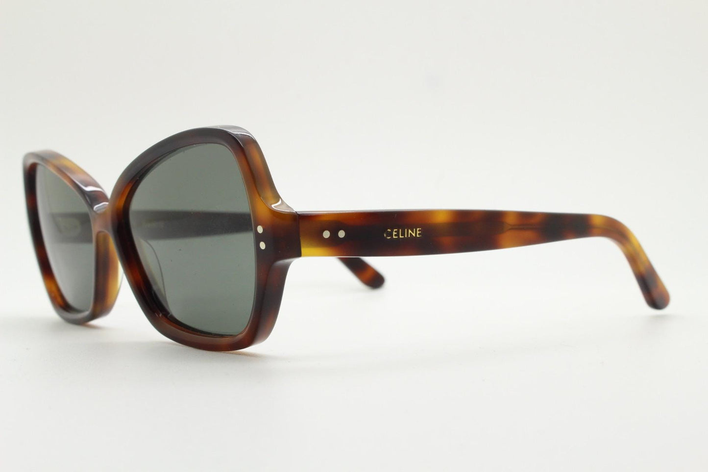 Celine Paris vintage angular cat eye sunglasses made in Italy. Tortoise butterfly frame in good proportions with green lenses. Womens Y2K
