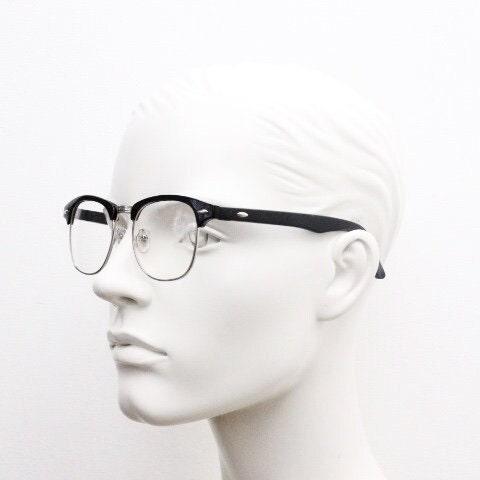 90s vintage black half frame eye glasses. Black gloss browline with silver wire rim frame and clear lenses. Classic 50s, 60s design. NOS