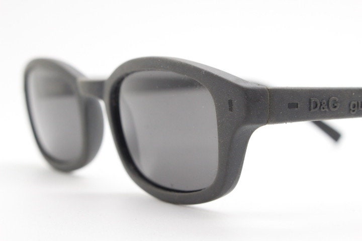 Dolce and Gabbana gum sunglasses made in Italy. Mens 90s vintage innovative flexible grey rubber frame with black lenses