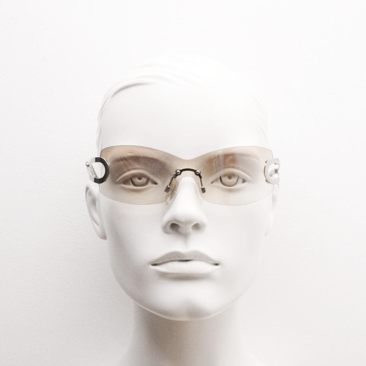 Y2K vintage visor sunglasses. 2000's brown wraparound mono lens shield design with looped chrome temples. 00s uber fashion mini mask NOS