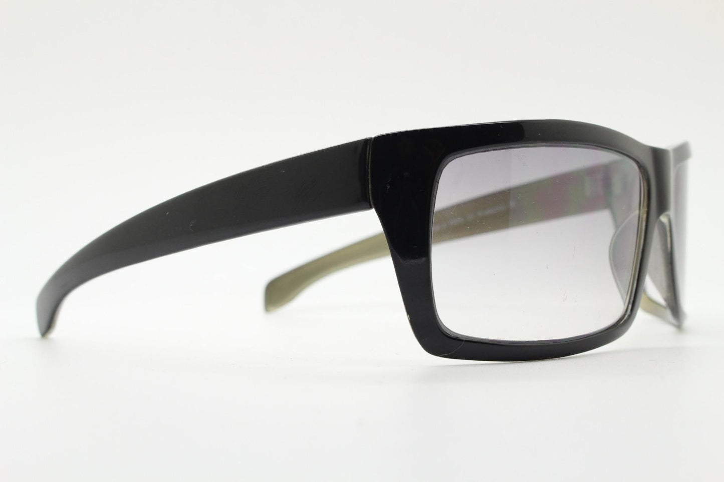 Y2k vintage wrap around large rectangular sunglasses. Curved black gloss frame with tasteful graduating lenses. 2000's NOS