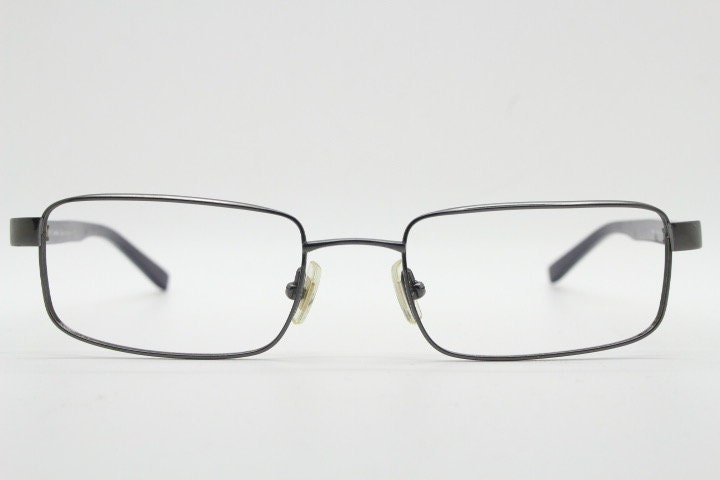 Calvin Klein collection rectangular eye glasses model 582 made in Japan. Gunmetal grey wire optical frames. Prescription eyeglasses. RX